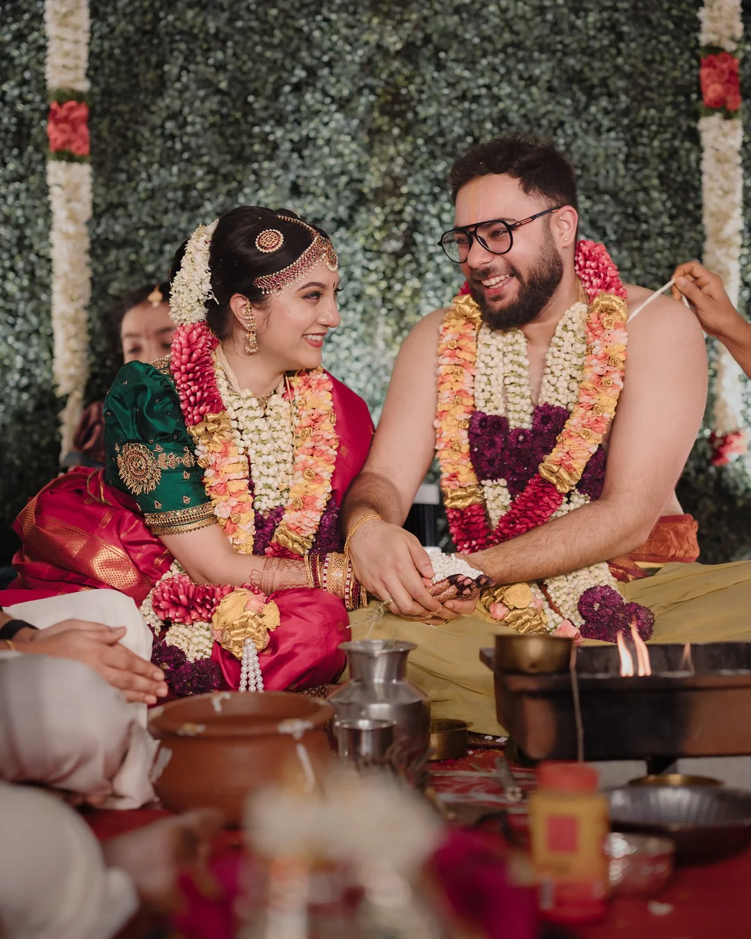 A newlywed couple smiling together during their wedding ceremony